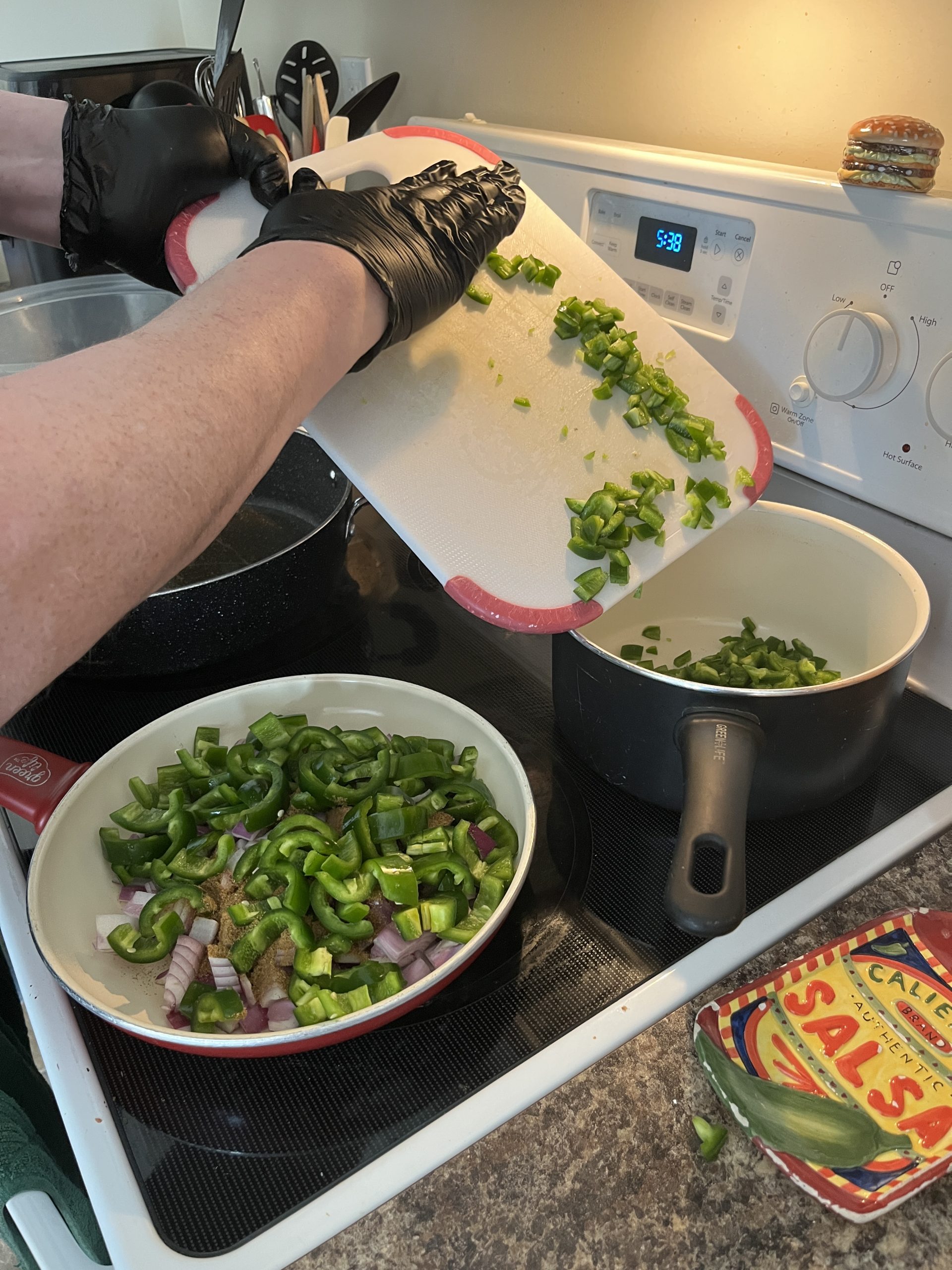 In goes the jalapenos and red onions